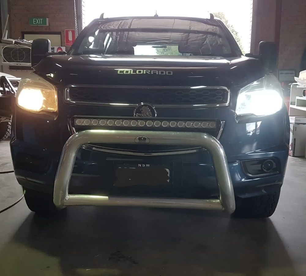 A Black Colorado Truck Is Parked In A Garage — Tuned Suspension & Mechanic in Parkes, NSW