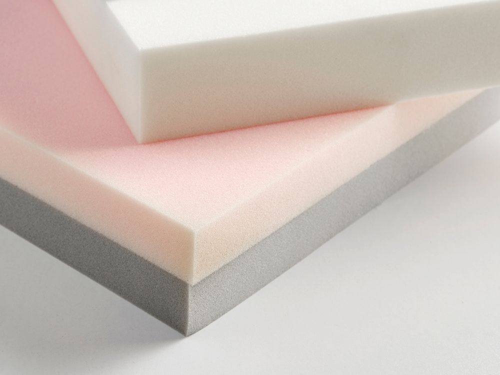 Three Pieces Of Foam Are Stacked On Top Of Each Other On A White Surface — Allwood Upholstery In Manunda, QLD
