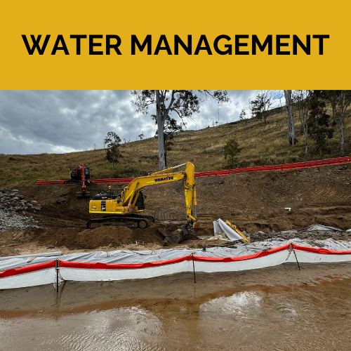A yellow spencer civil & earthworks excavator is digging is moving dirt next to a silt fence and waterway.