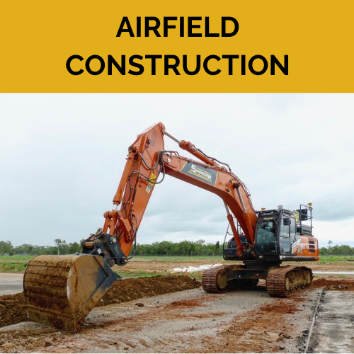 A large Spencer civil & earthworks excavator is scraping the ground to flatten it.