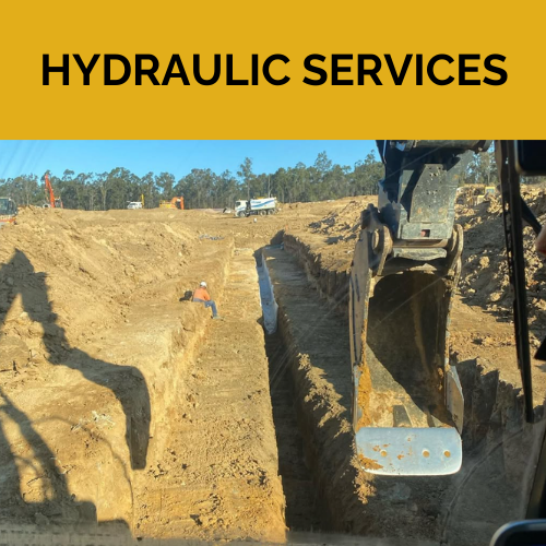 A Spencer Civil & Earthworks excavator is digging a trench to connect a hydraulic service.