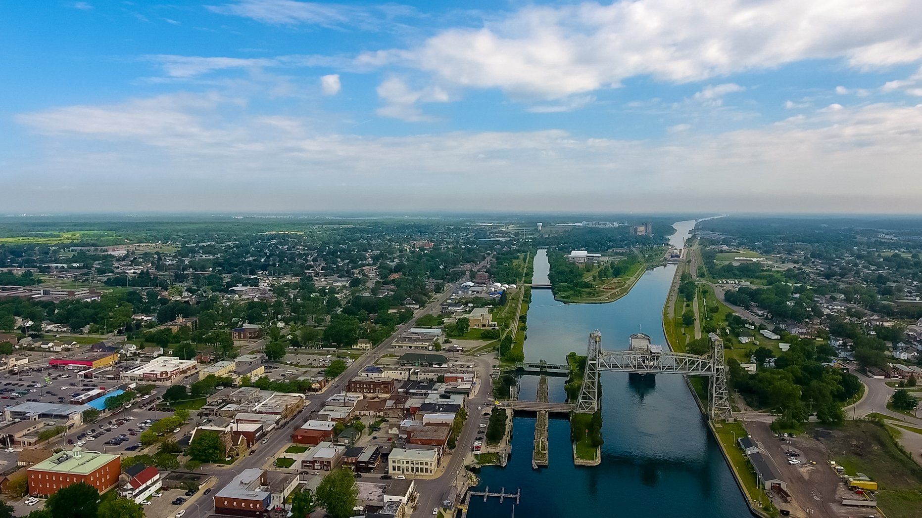 An aerial view of a city with a river running through it.
