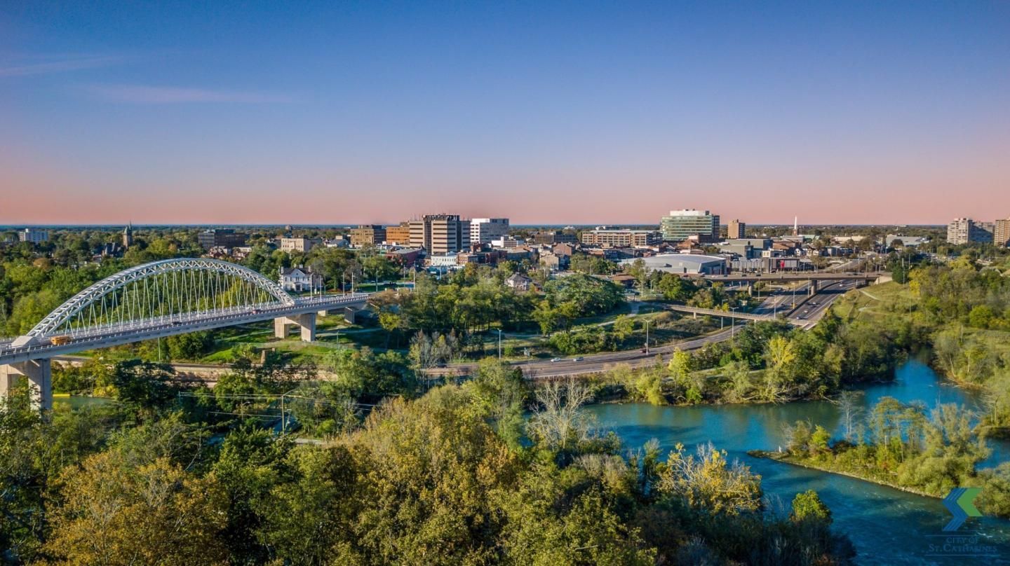 An aerial view of a bridge over a river in a city.