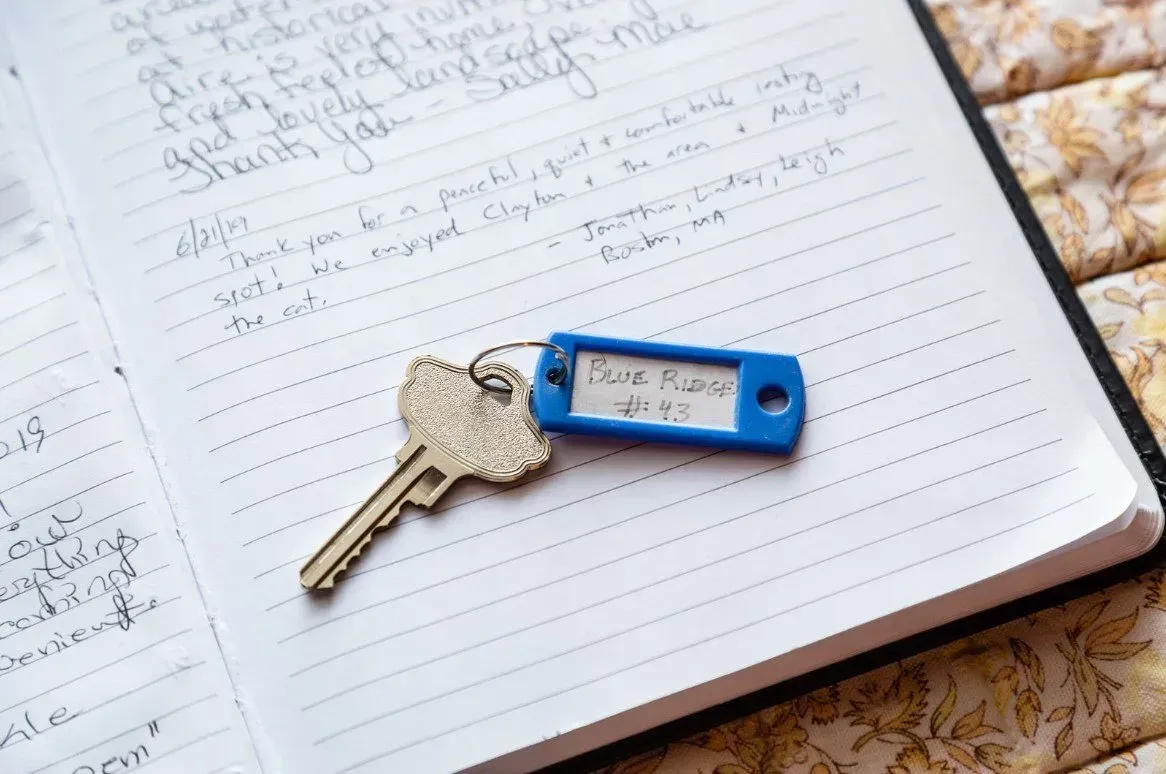 Key on a notebook, blue tag labeled