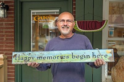 Frank holding signage.