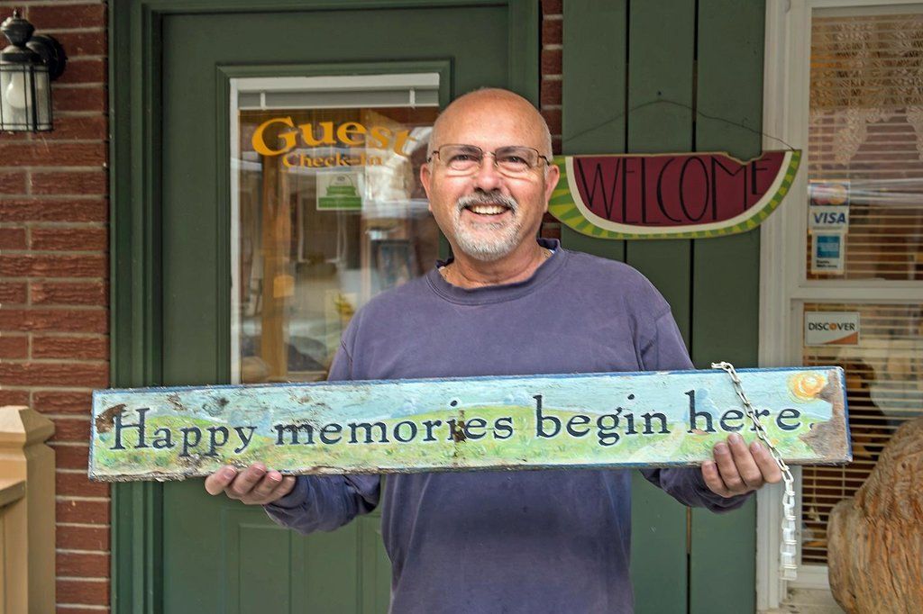 Frank holding signage.