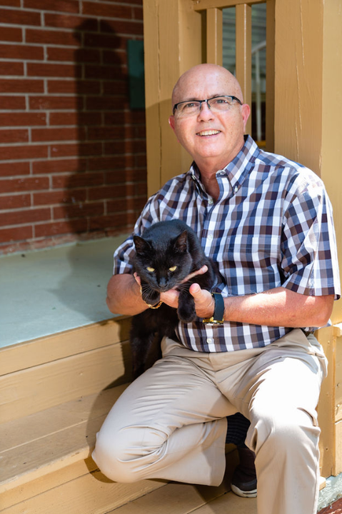 Frank holding his cat.