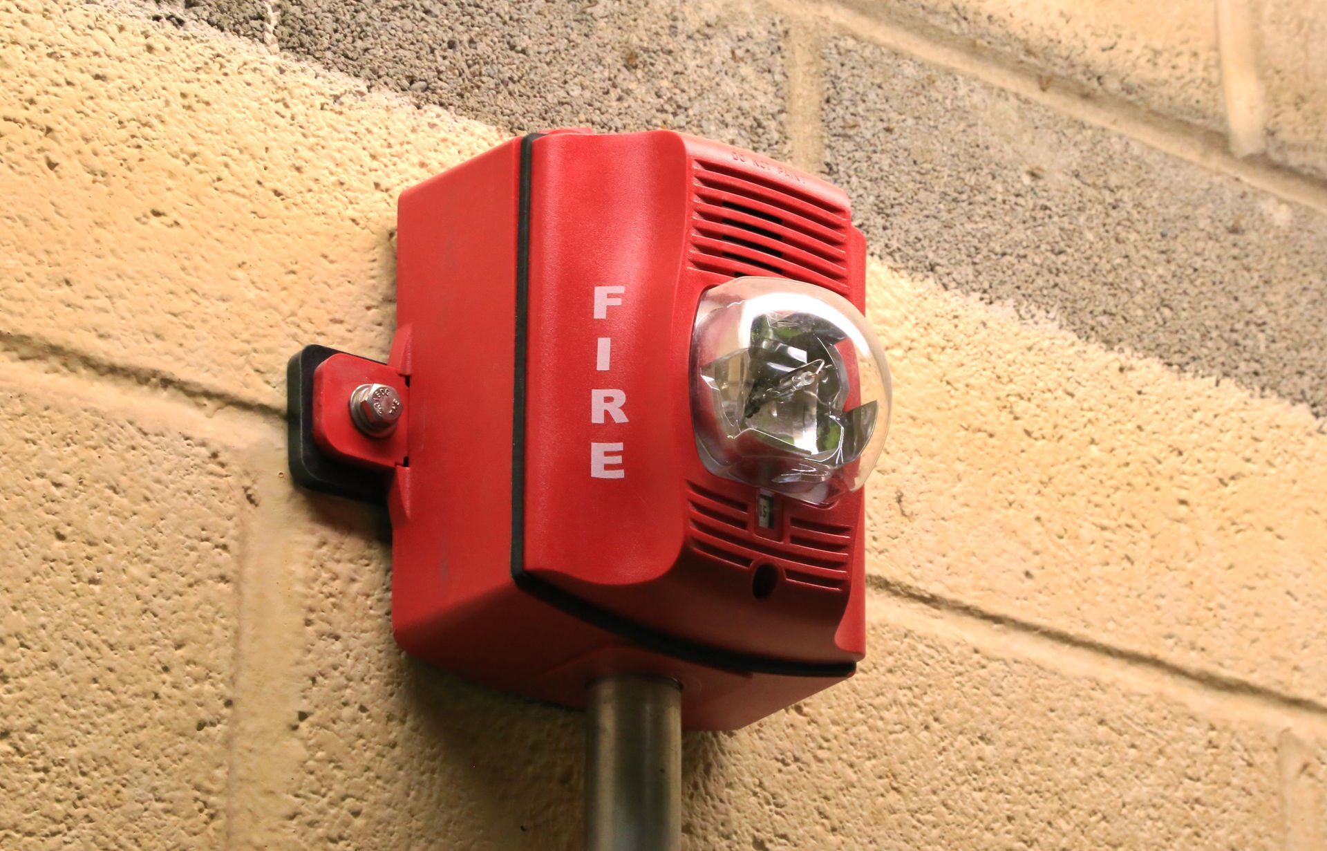 Person Entering Code On Keypad — Hot Springs, AR — Armor Alarms Person Entering Code On Keypad — Hot Springs, AR — Armor Alarms