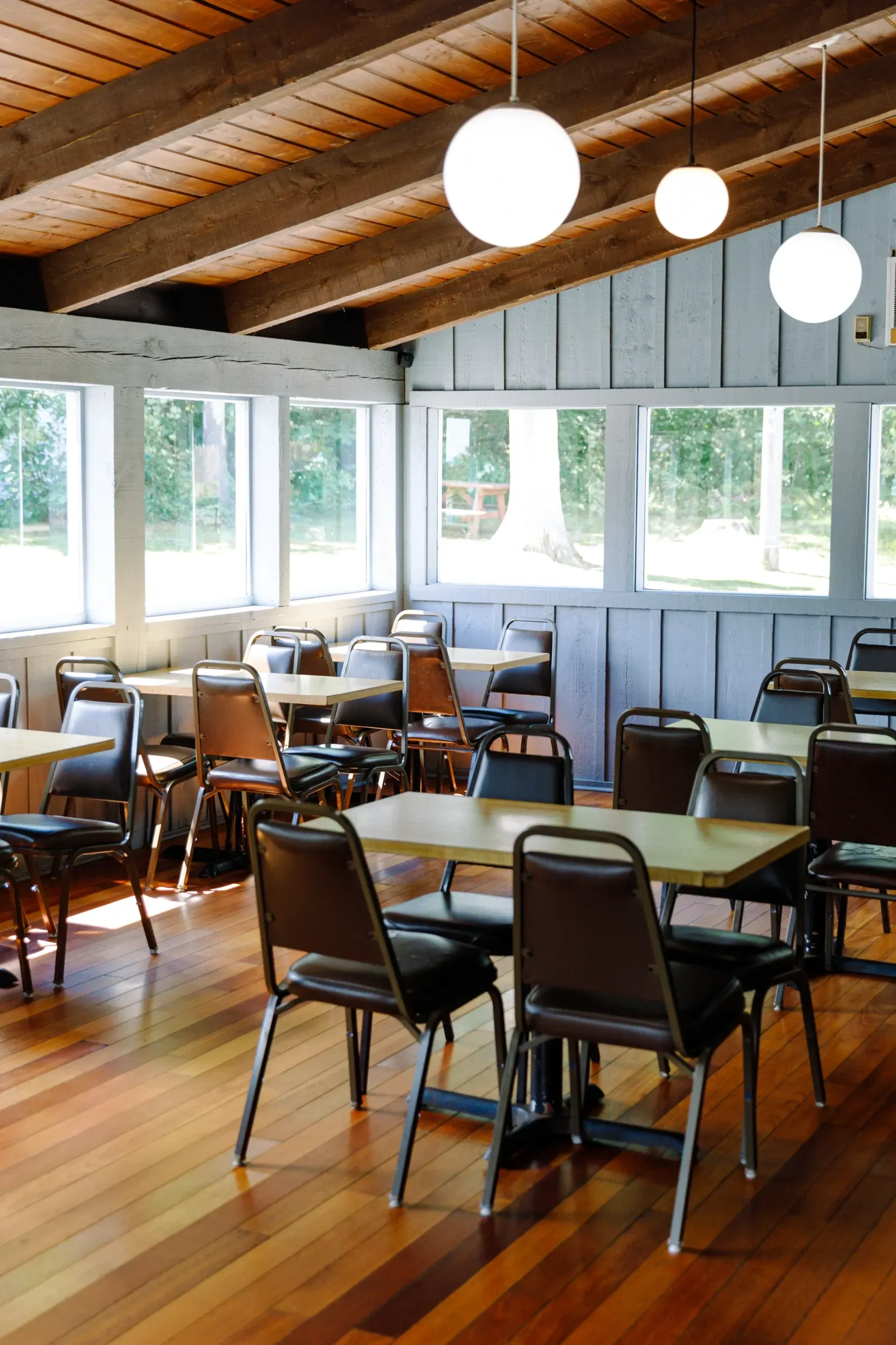 The seating area at Ken's Seafood with lots of windows in the background.