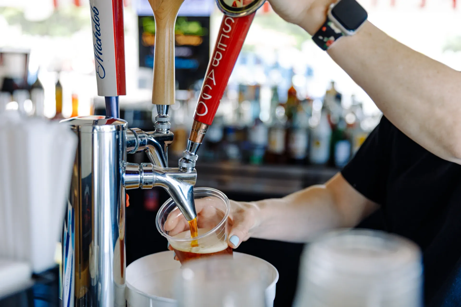 Pouring a drink at the bar of Ken's Seafood Restaurant.