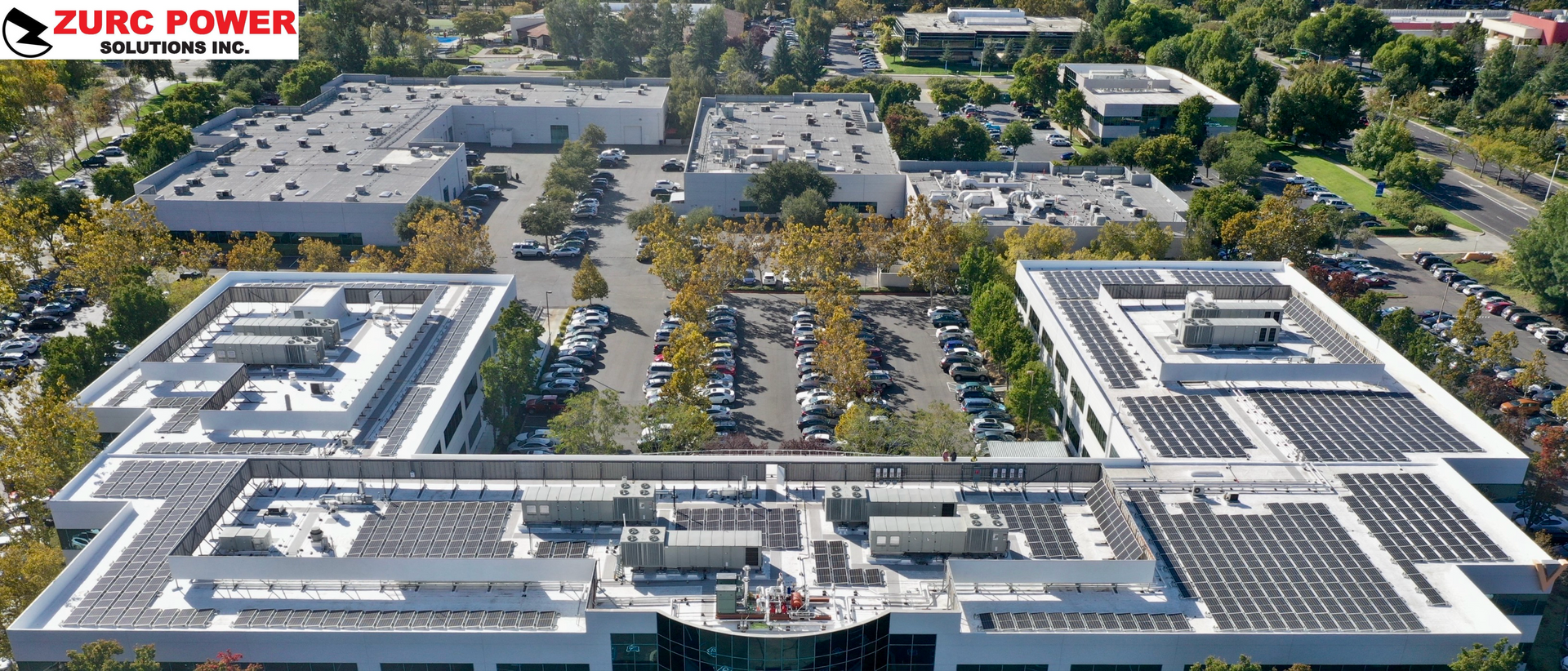 An aerial view of a large building that says zumc power