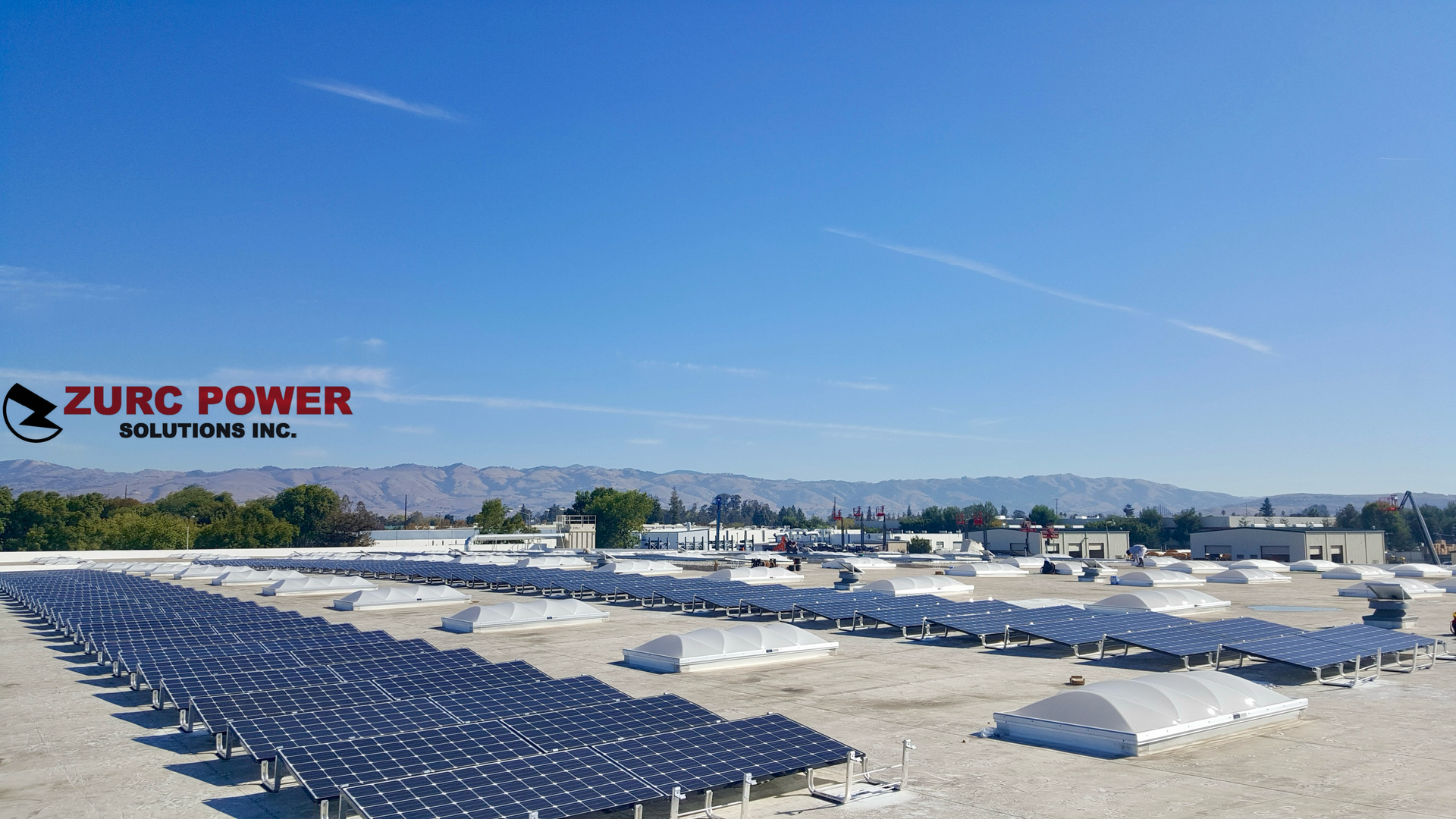 A bunch of solar panels on the roof of a building