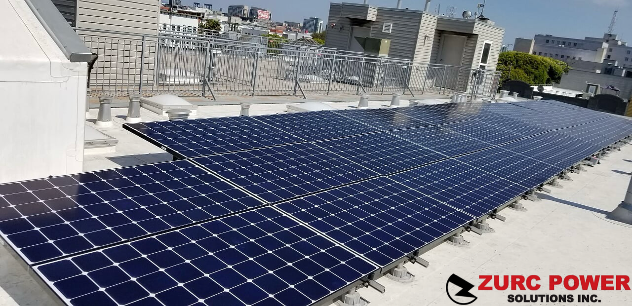 A bunch of solar panels on the roof of a building