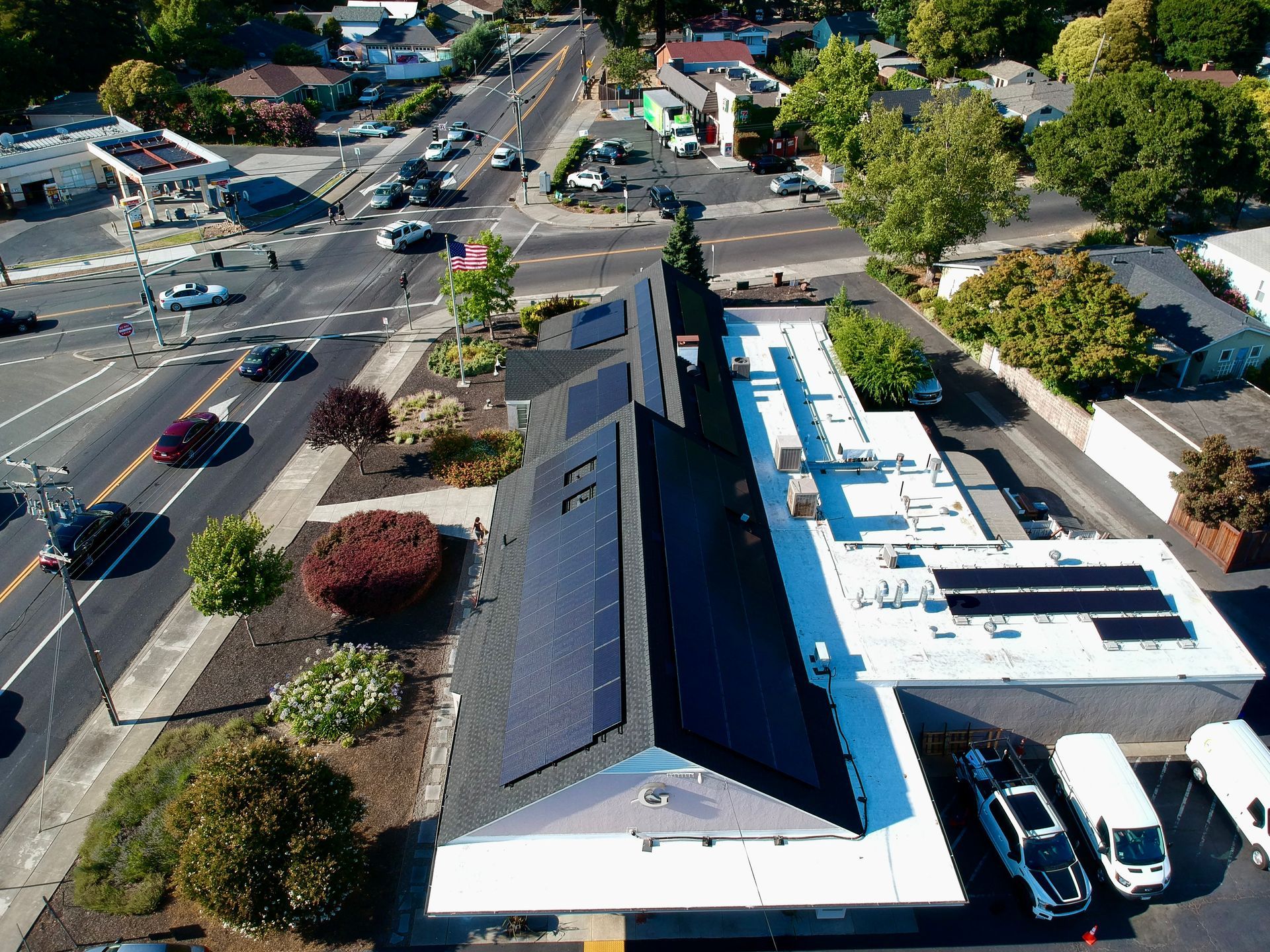 An aerial view of a building with solar panels on the roof