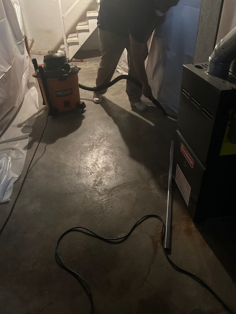 HEPA vacuuming soot from fire-damaged basement surfaces in Florissant residential home