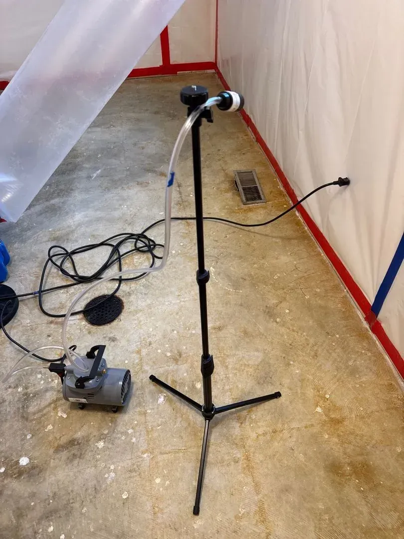 Second air sample collection during post-abatement clearance test