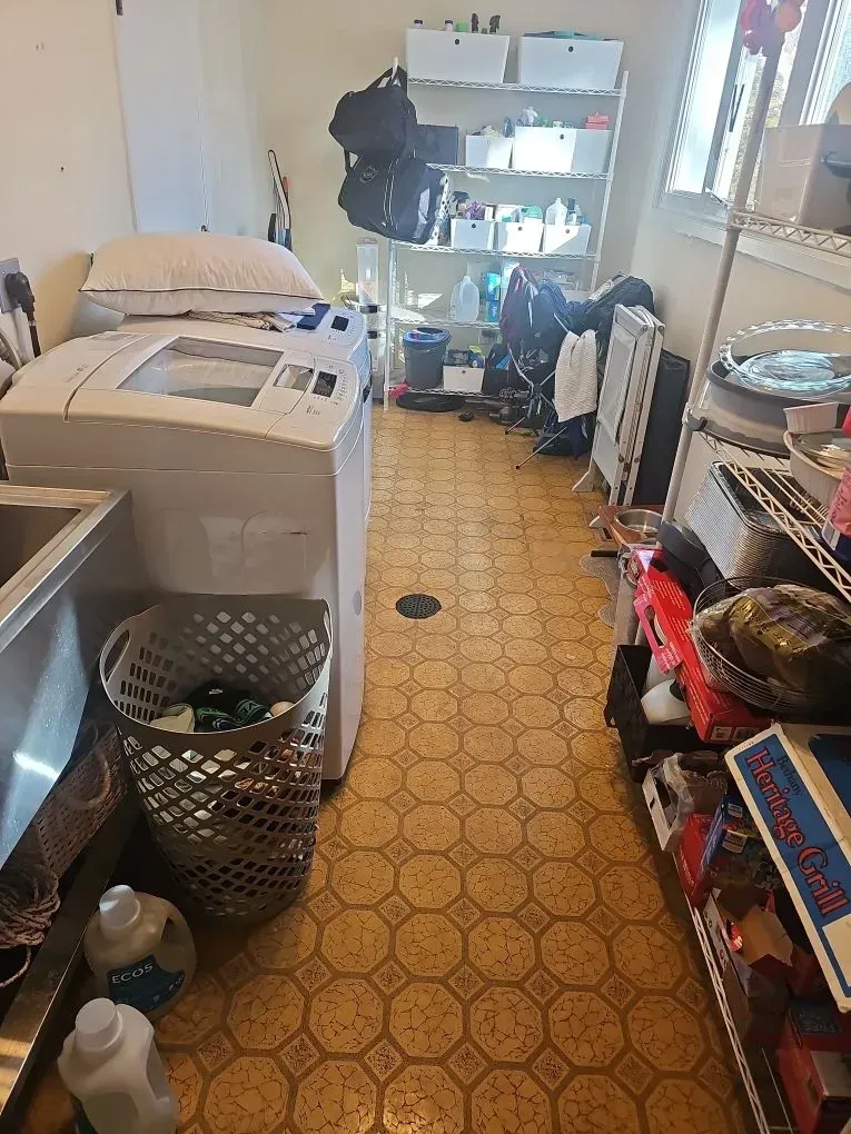 Close-up of ACM materials in residential laundry room prior to abatement