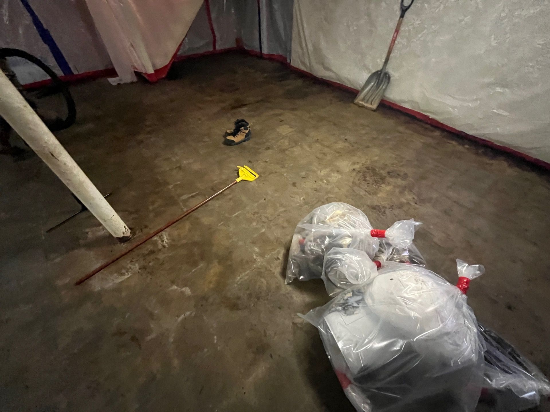 Controlled demolition during professional asbestos removal in a basement