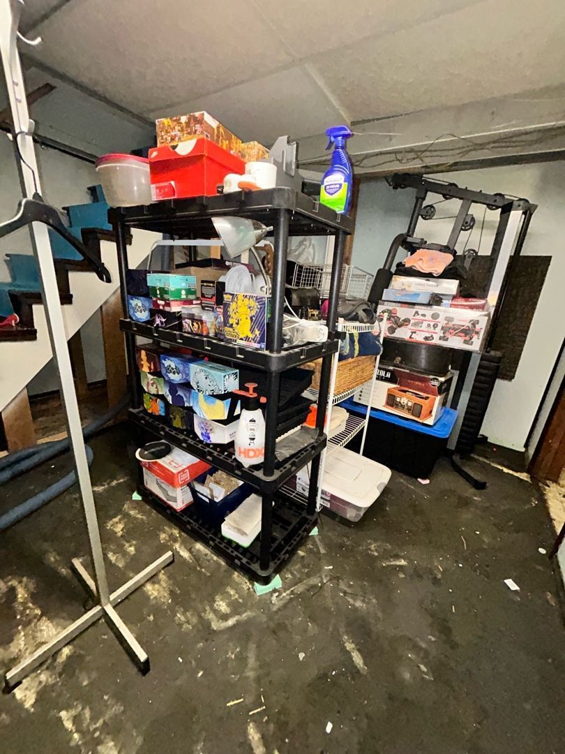 Basement water damage mitigation with drying equipment and containment in place
