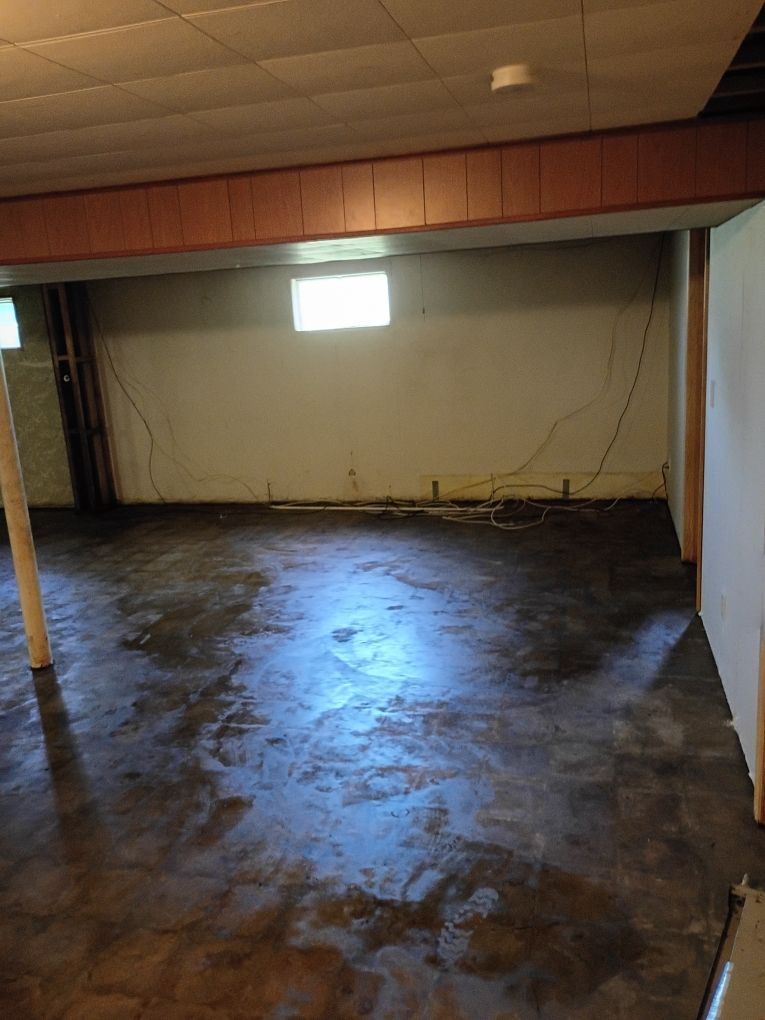 Basement after water mitigation and asbestos removal, cleaned and dried