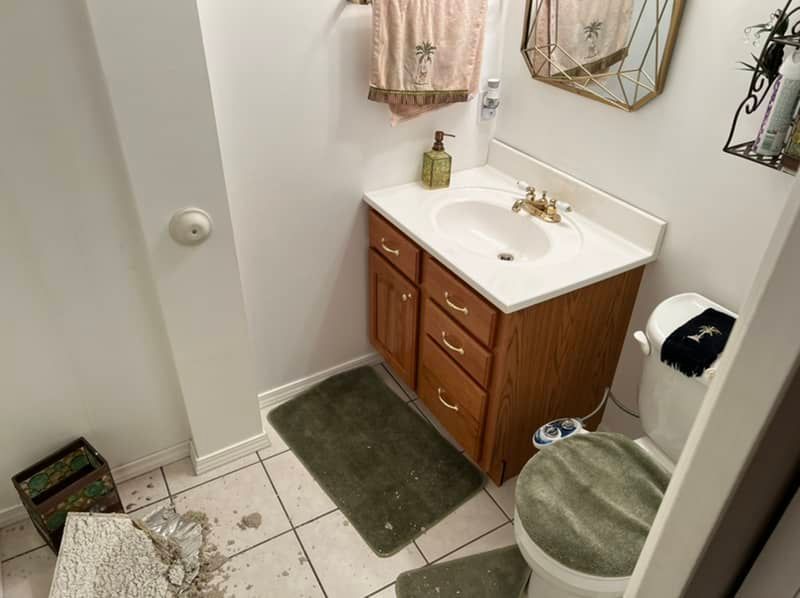 water damaged bathroom ceiling in st. louis, mo home
