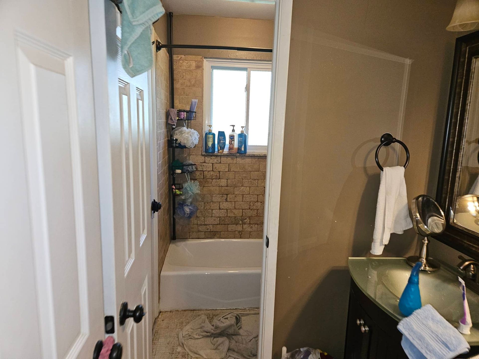 Bathroom stripped to the subfloor during water damage restoration