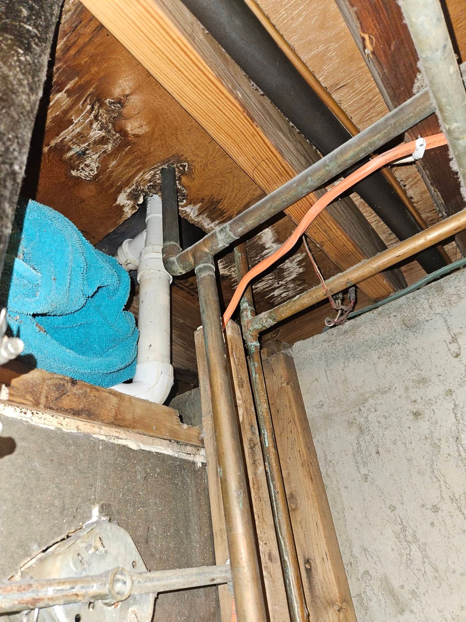 Bathroom water damage exposed during inspection before restoration