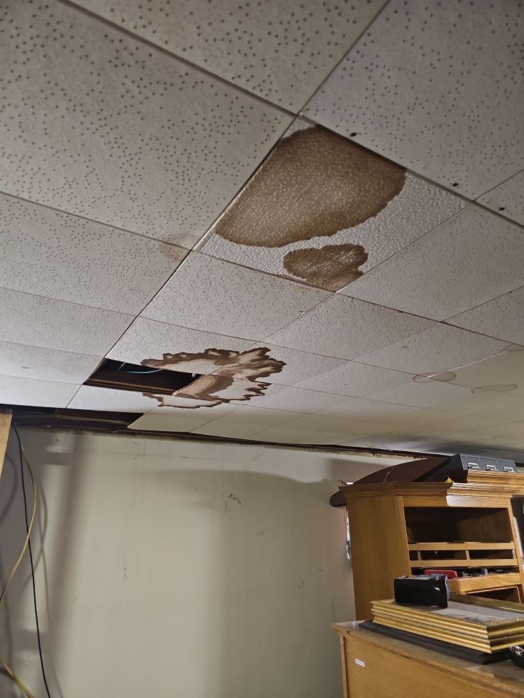 Close view of ceiling water damage in a residential basement