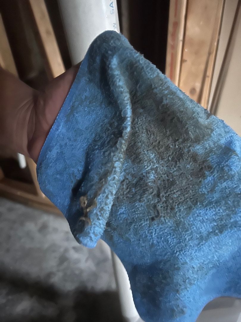 Cleaning soot deposits from basement walls during fire damage restoration