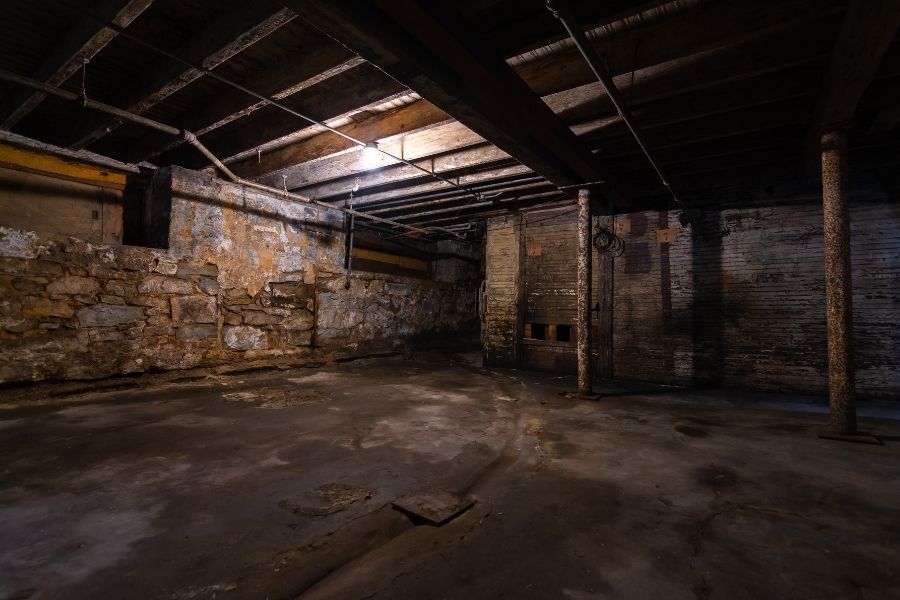 Moisture damage visible on basement walls