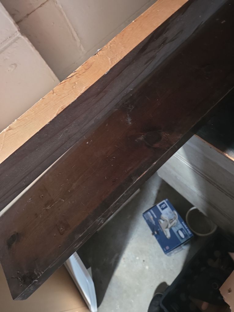 Baseboards stained with soot and smoke residue after basement fire in Florissant home