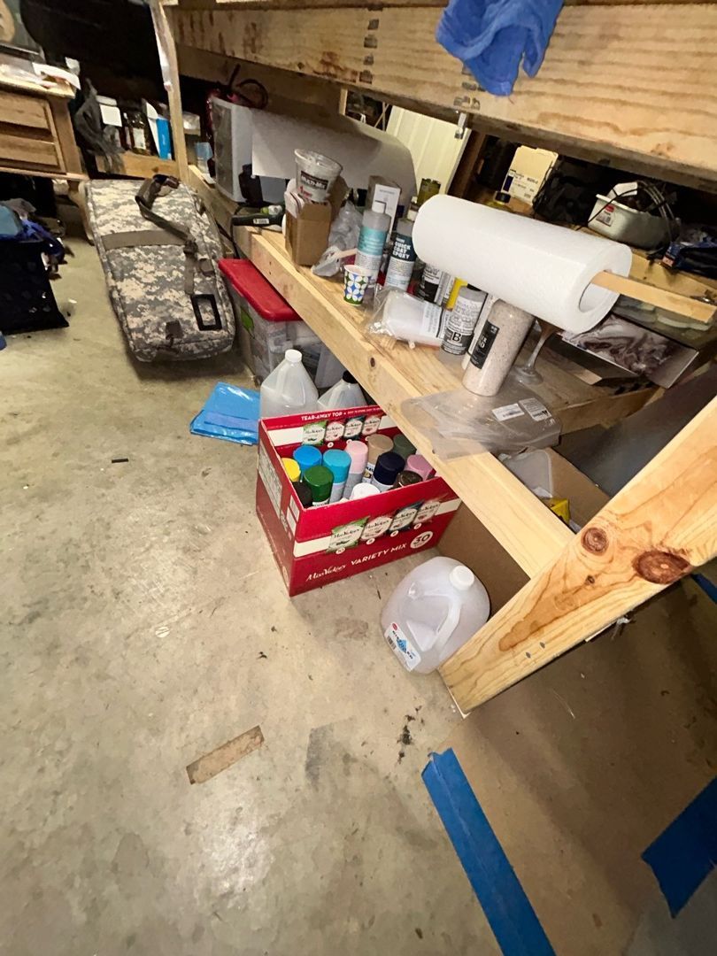 Initial assessment visit in the water-damaged basement showing affected flooring and belongings