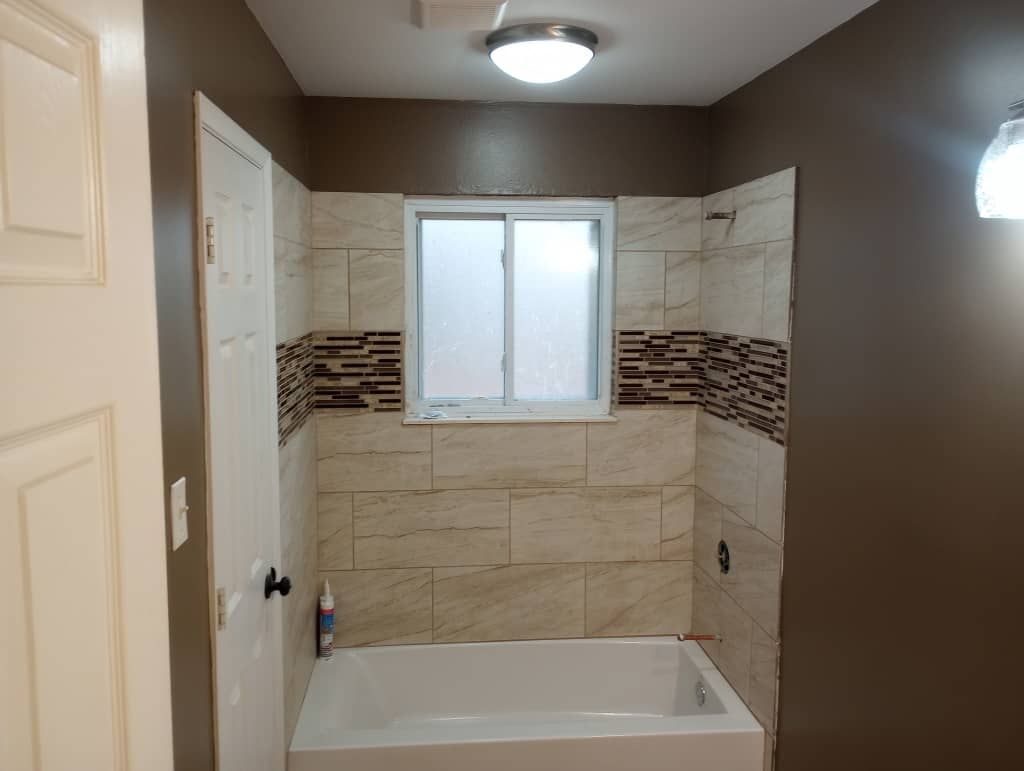 New subfloor and building materials installed in the water-damaged bathroom during reconstruction
