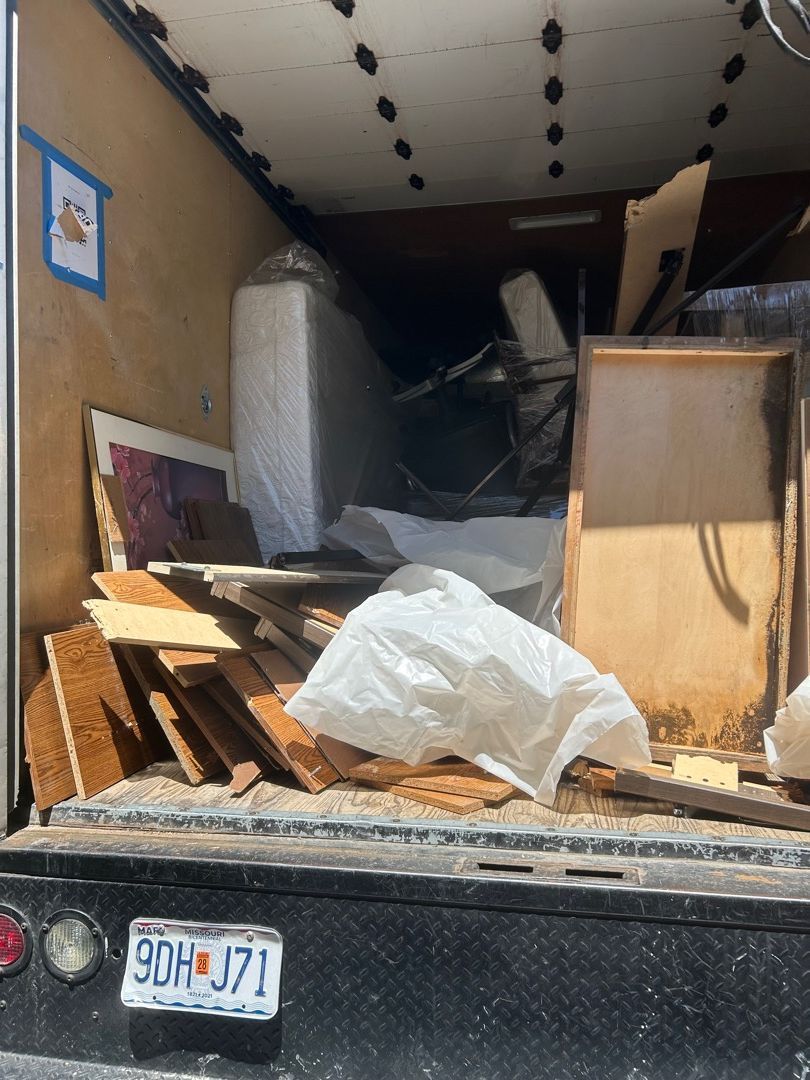 Truck loaded with damaged materials and salvageable items during pack-out services