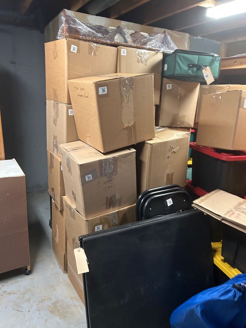 Labeled boxes packed and stacked ready for transport to a secure storage facility