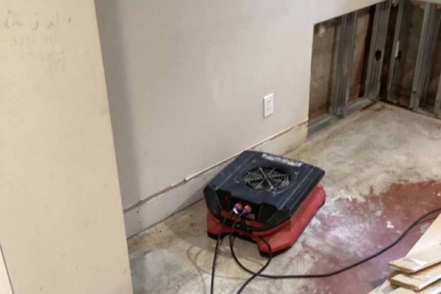Professional drying equipment and demolition during water damage restoration in a multi-family property