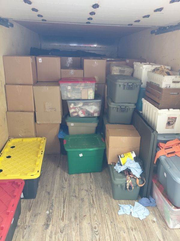 Personal items carefully packed into labeled boxes after basement water damage