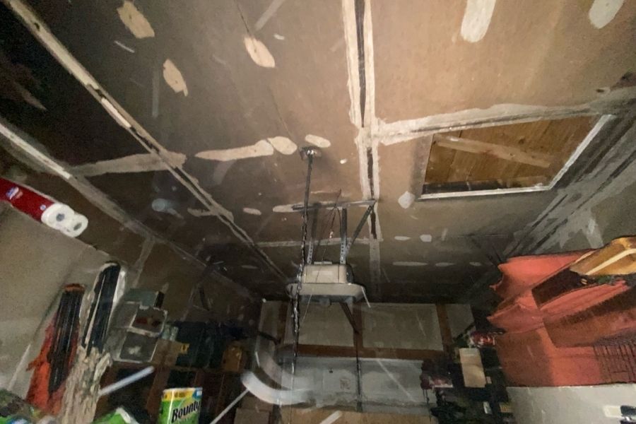 Visible black soot staining across a fire-damaged ceiling in a residential home