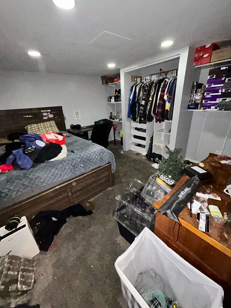 Water damage affecting a finished basement bedroom with drying equipment running