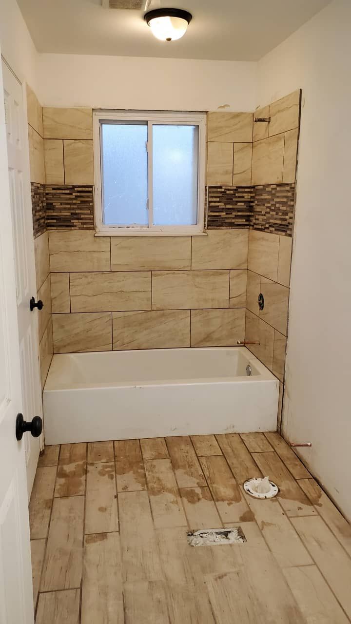 Water damage restoration of a residential bathroom in progress with drying underway