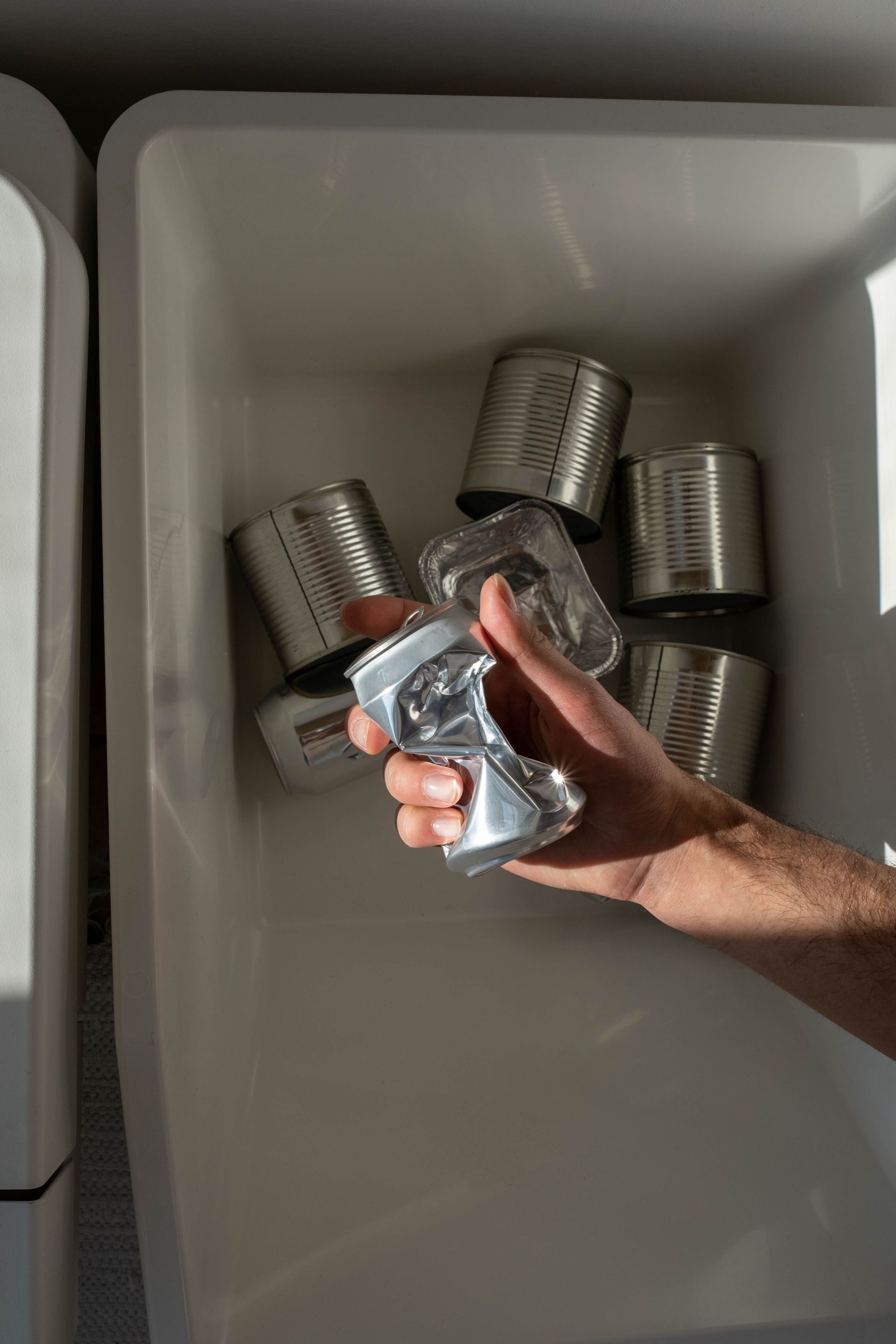 Technician repairing a washing machine drum in a laundry room