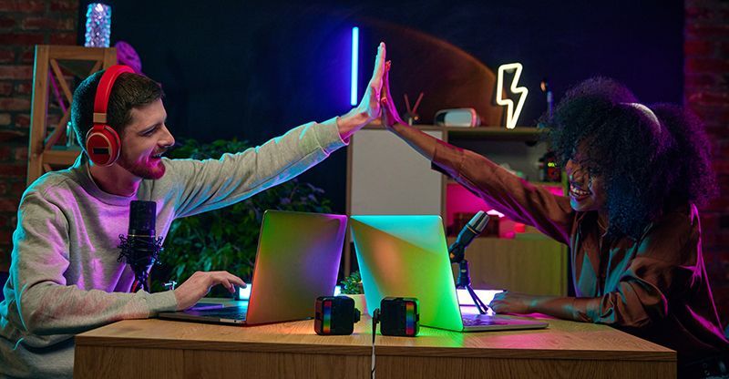 two creators high fiving celebrating a small / quick win