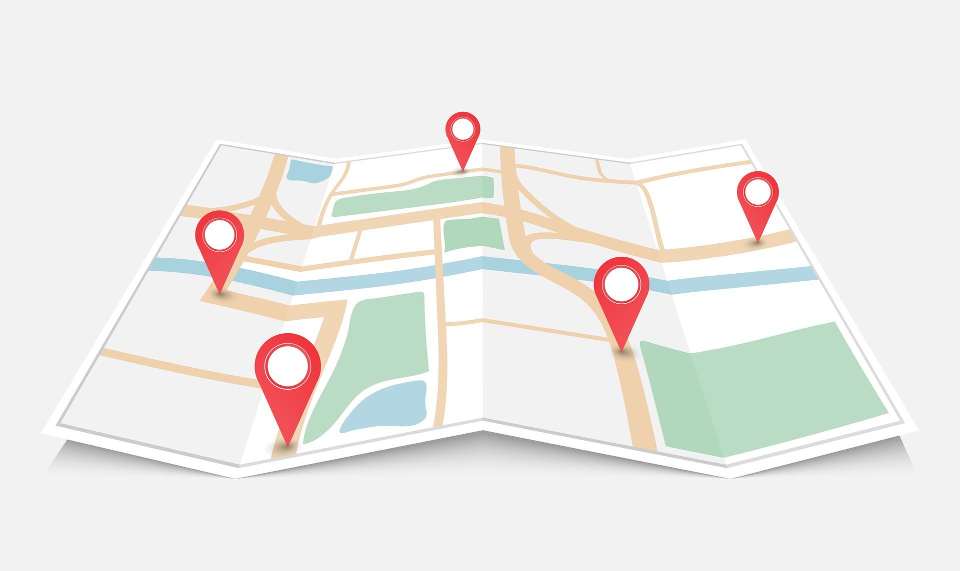 Folded city map with red location pins marking several points along streets and blocks