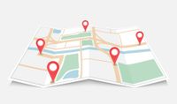 Folded city map with red location pins marking several points along streets and blocks