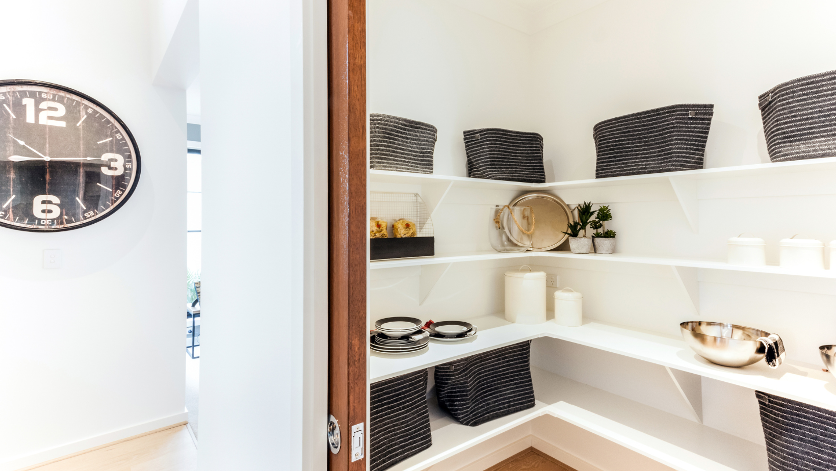 Storage closet with pocket doors in a Vermont home. 