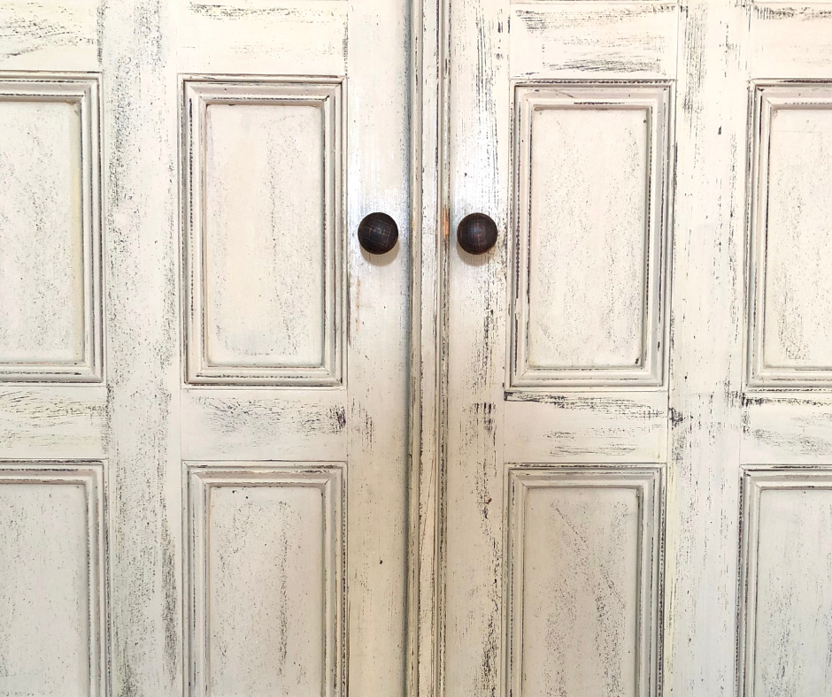 Cream colored distressed kitchen cabinets in a Vermont home.