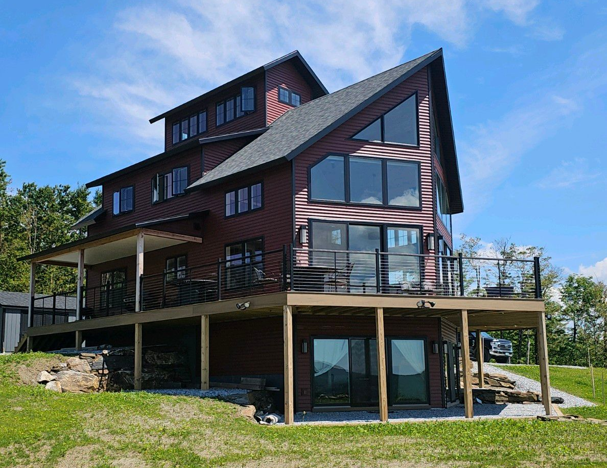 Custom home built by Tanguay Homes in Northern Vermont with modern design and large windows