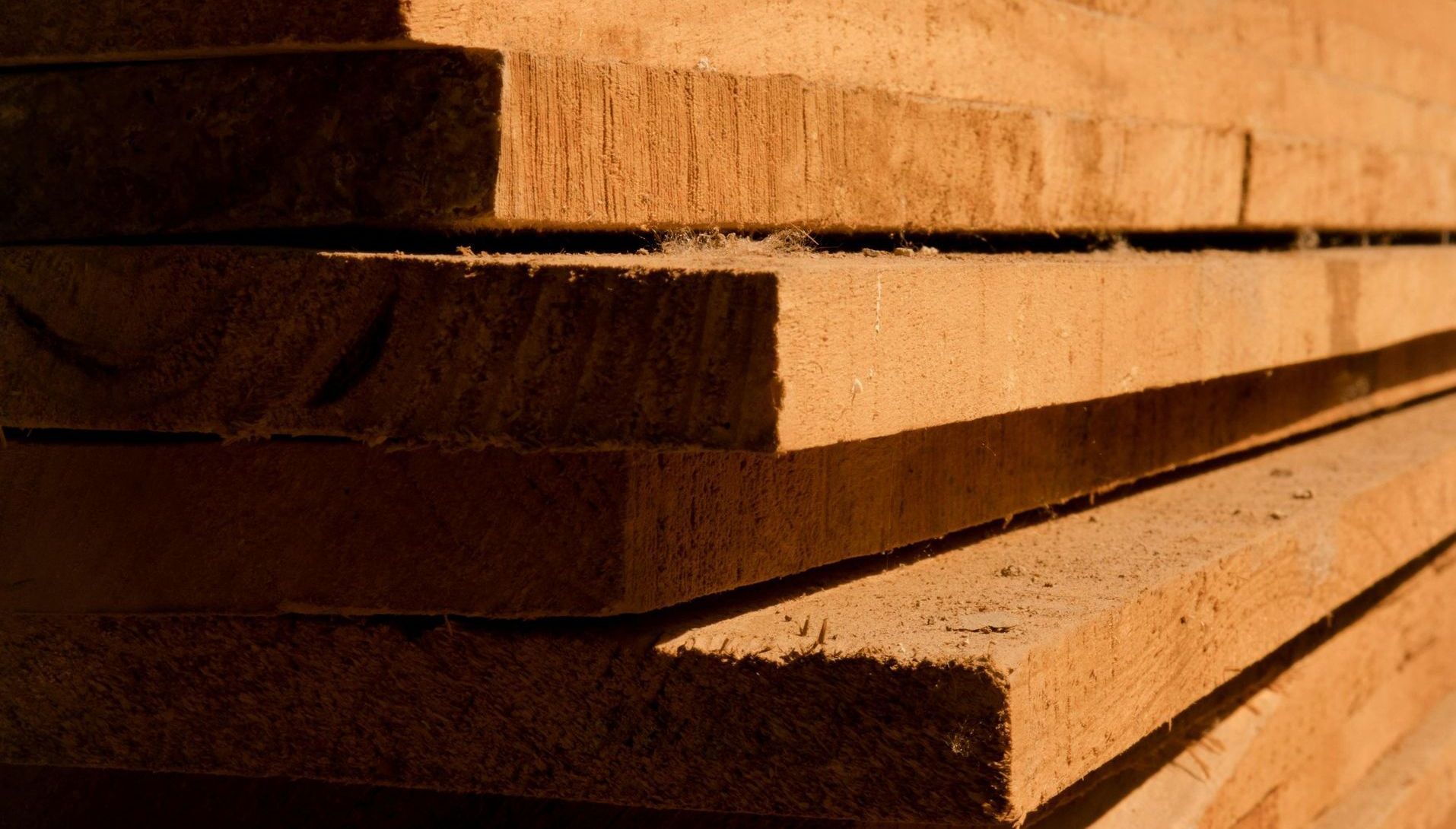 A close up of a stack of wooden boards