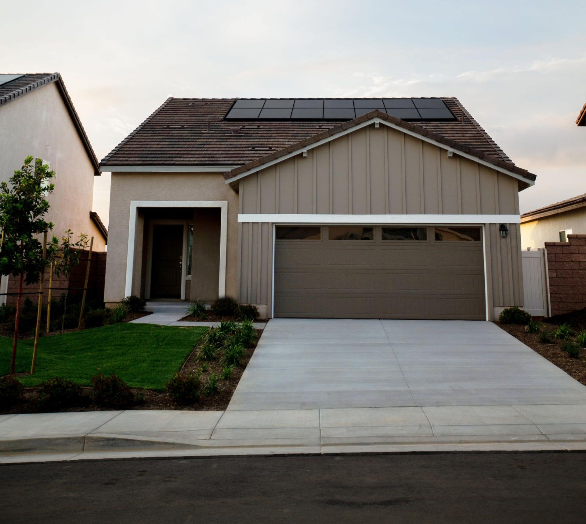 Shot of new-build suburban home with garage as focal point
