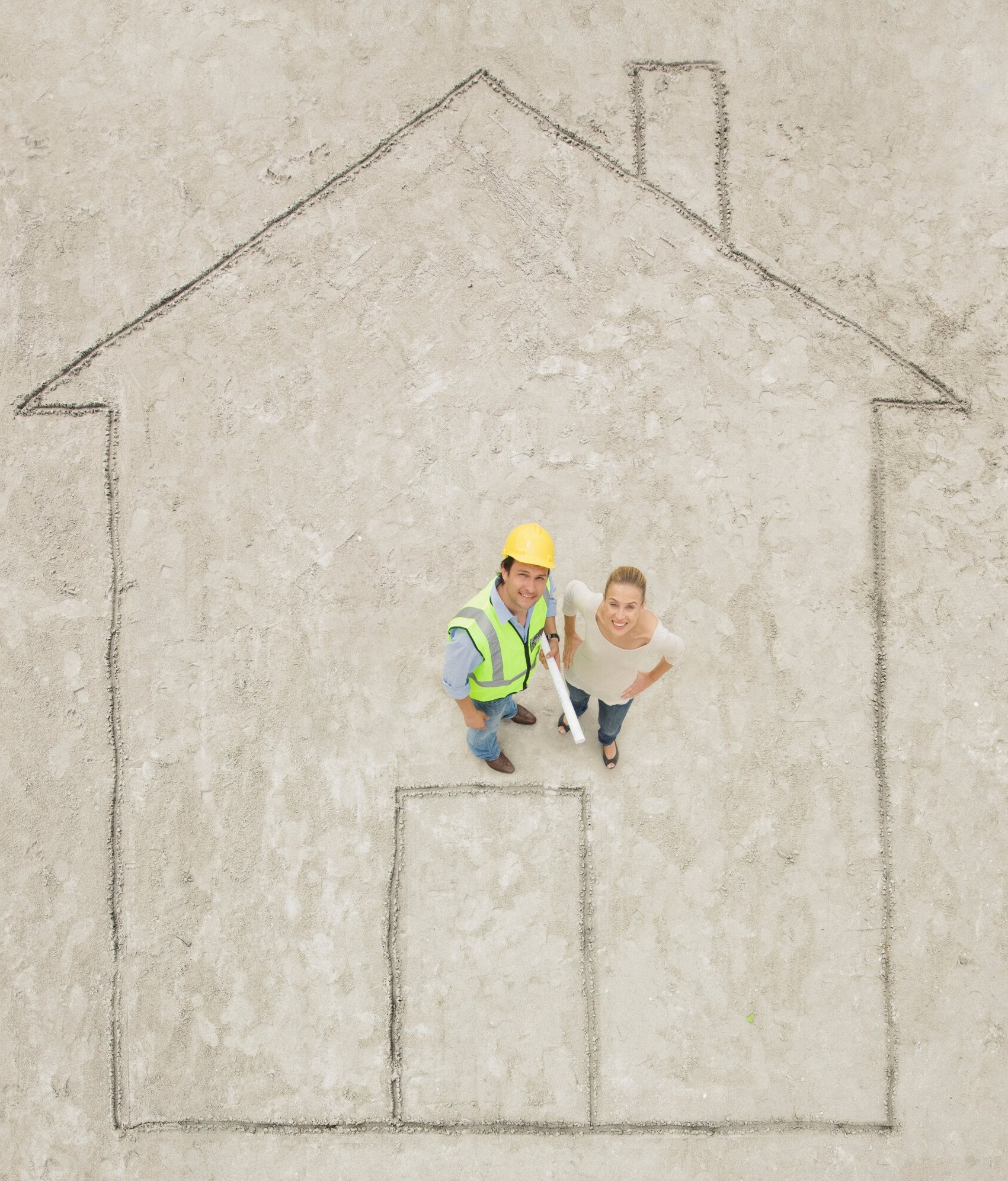 Home contractors calculating square footage.